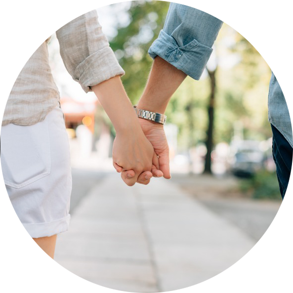 holding hands at the street while walking