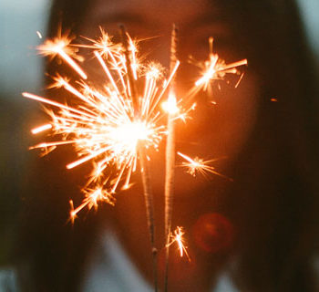 human watching a sparkler