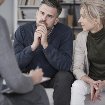 wife watching her husband during therapy