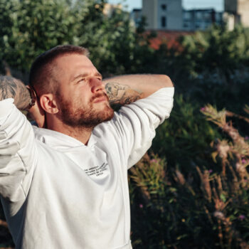 Relaxed bearded jewish man with tattoos